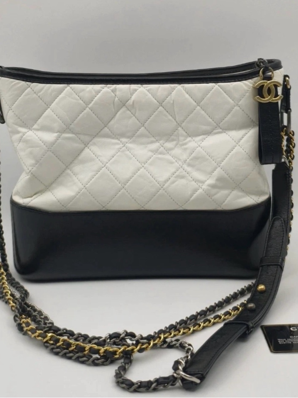 CHANEL Black and White Quilted Leather Hobo with Gold CC Charm